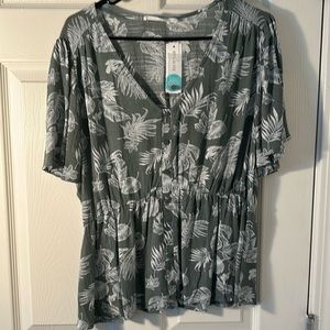 Green and white floral blouse